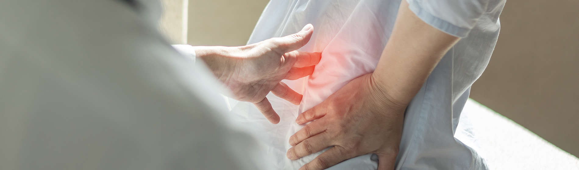 Person suffering from acute lower back pain