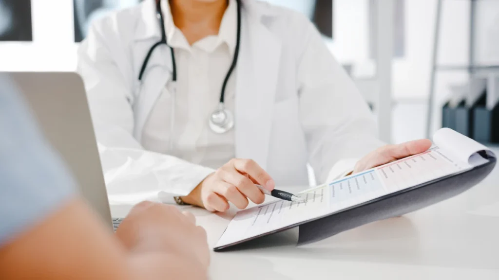 What Is Rheumatology? 12 Doctor reviewing and explaining a patient's medical report during a consultation.