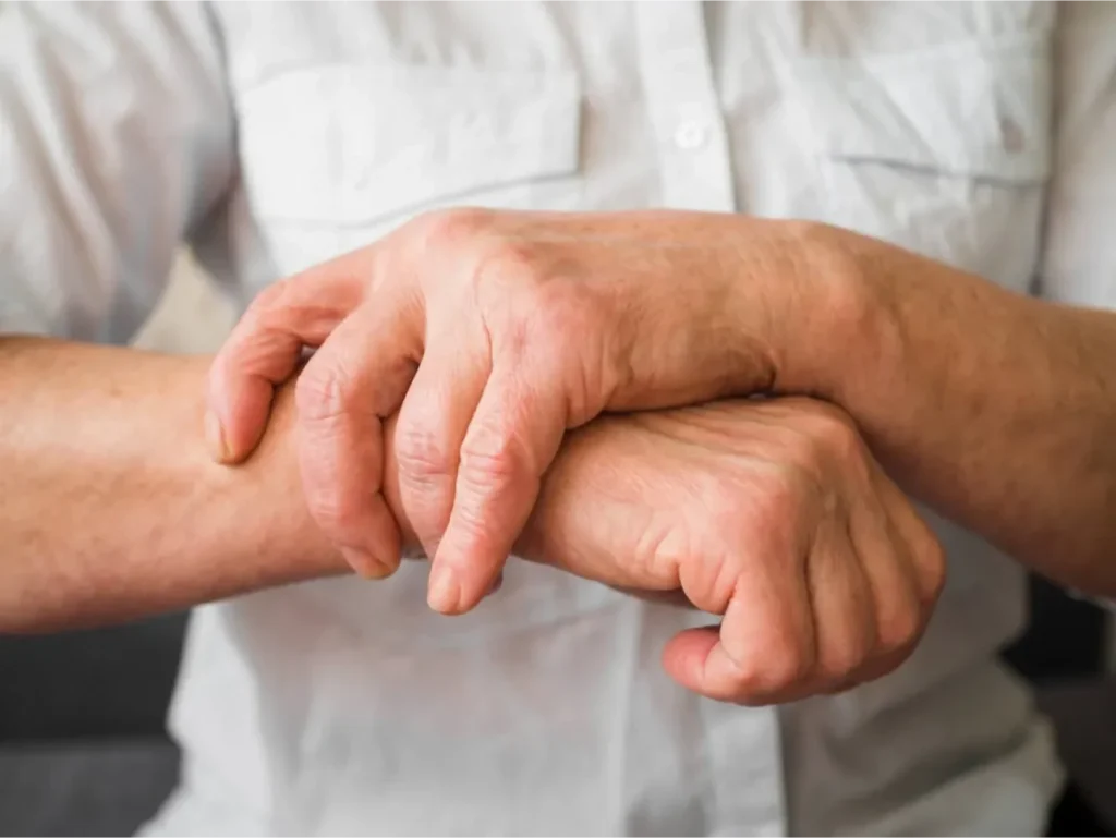 Recognizing the Common Symptoms of Arthritis 2 Person gripping their arm experiencing joint pain.